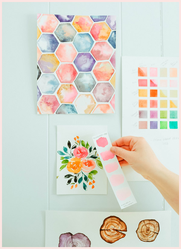 A topdown view photo of some greeting cards and color palettes.